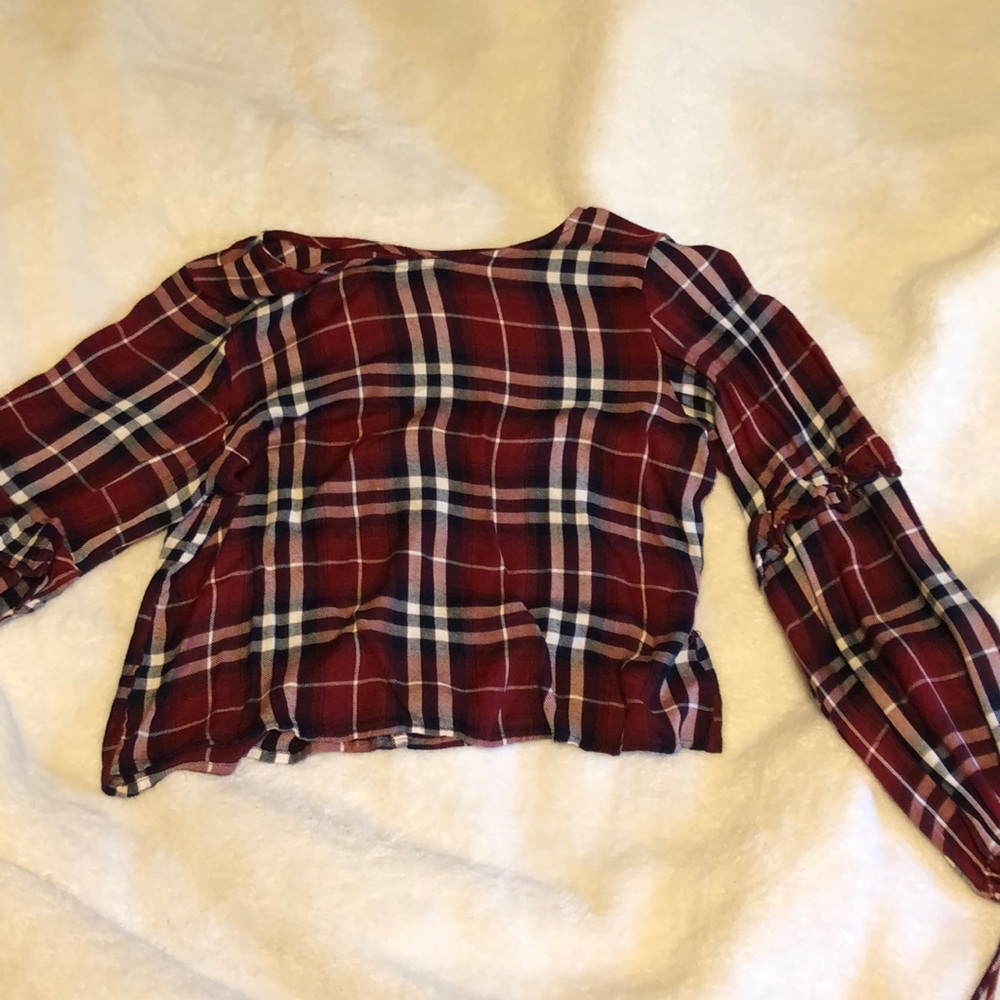 A really cute red and navy blue placid shirt shirt